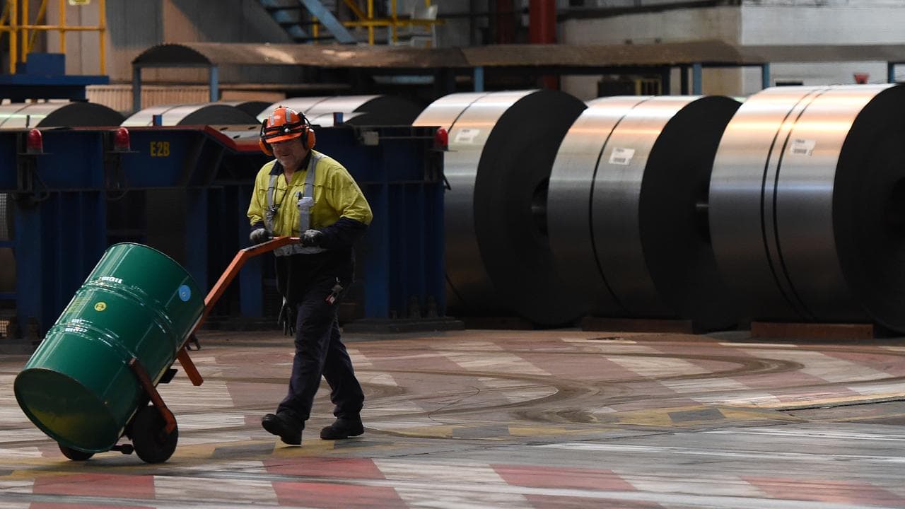 A steel worker with metal coils (file image)