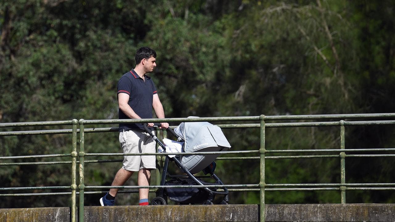 Man pushing pram