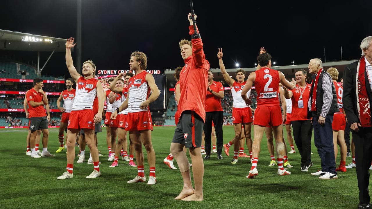 Callum Mills and his Swans teammates salute