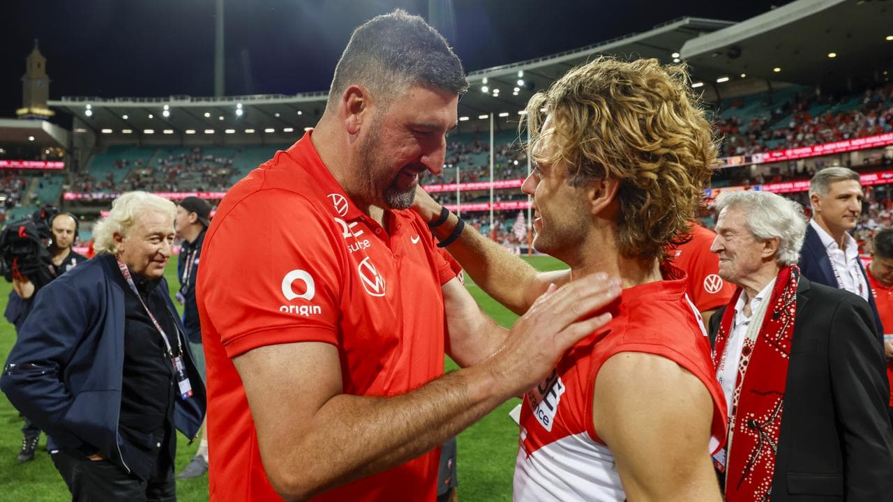 Swans coach Dean Cox congratulates James Rowbottom