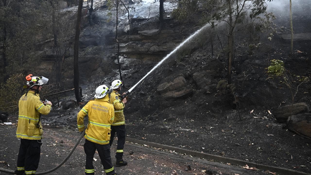Firefighters battle a blaze