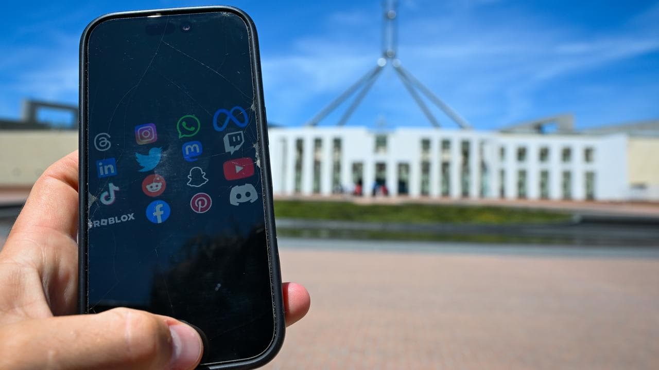 social media apps on the screen of a phone outside Parliament House