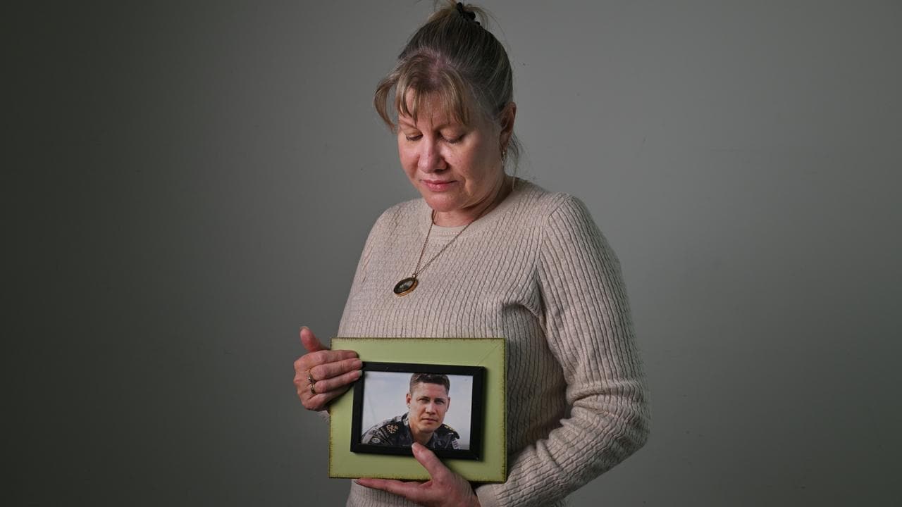 Julie-Ann Finney holds a photograph of her son David