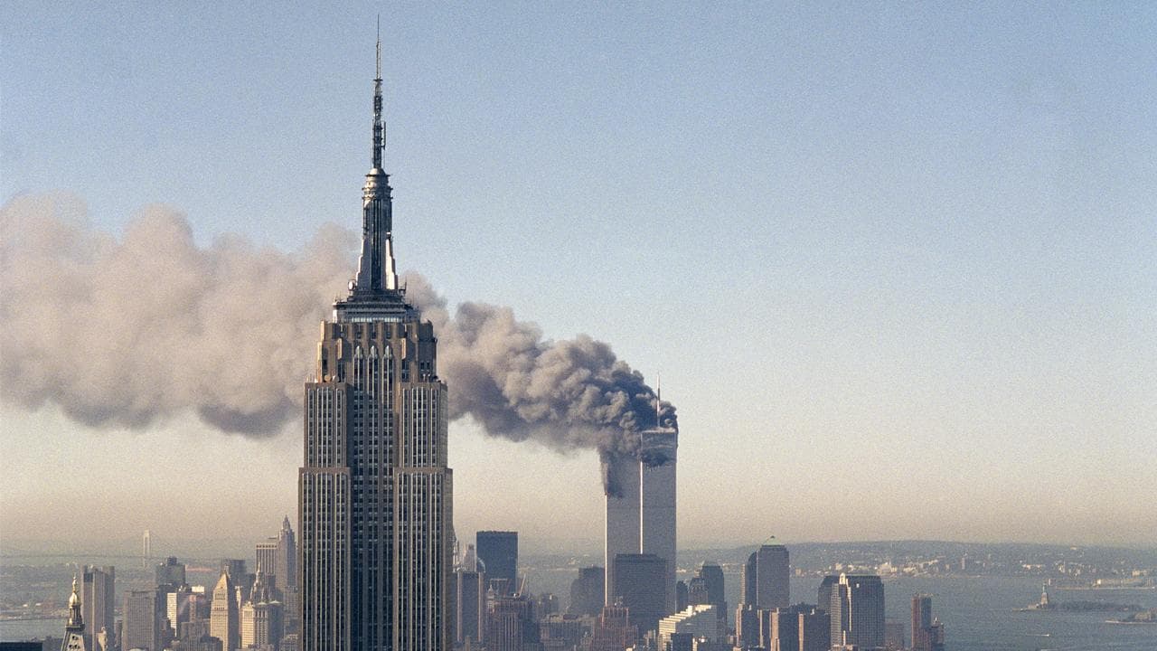 The twin towers of the World Trade Center burn