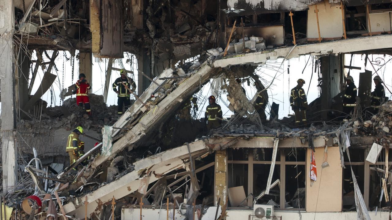 Ukraine rescue workers in rubble