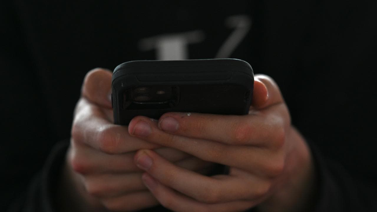 A person uses his mobile phone