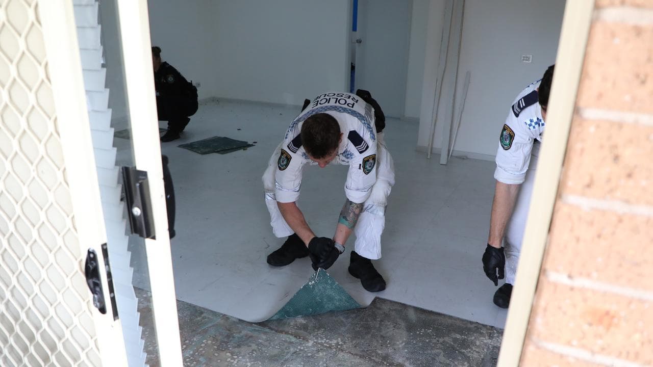 Forensic police lifting lino