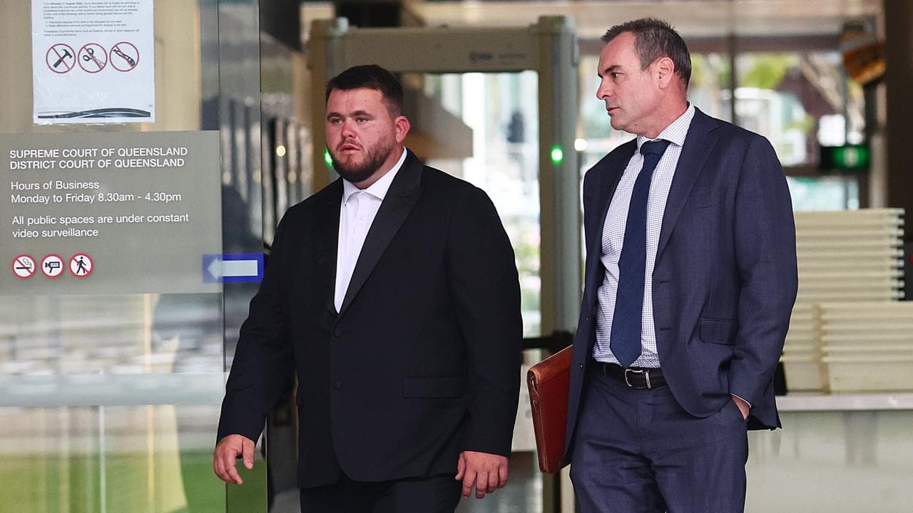 Two men in suits leave court