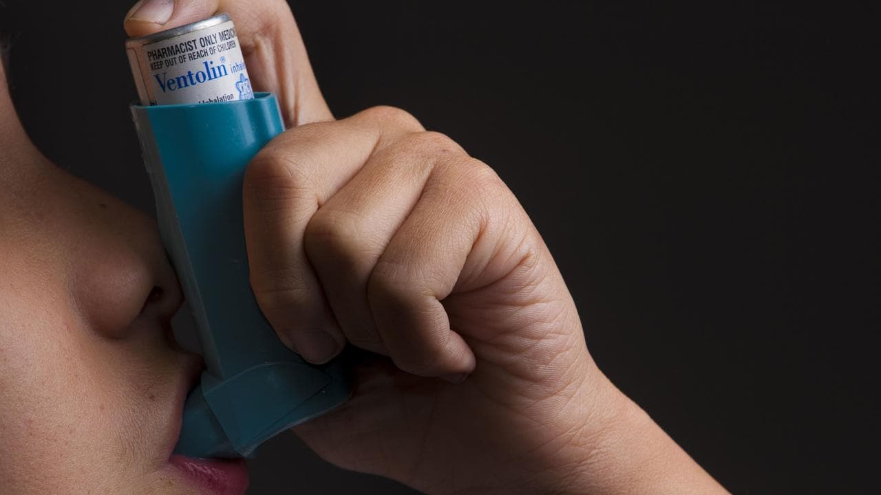 A asthma inhaler is pictured in use, Brisbane