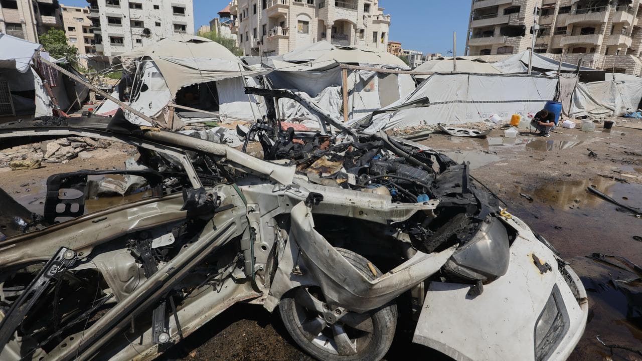 A destroyed vehicle following an Israeli military strike in Gaza