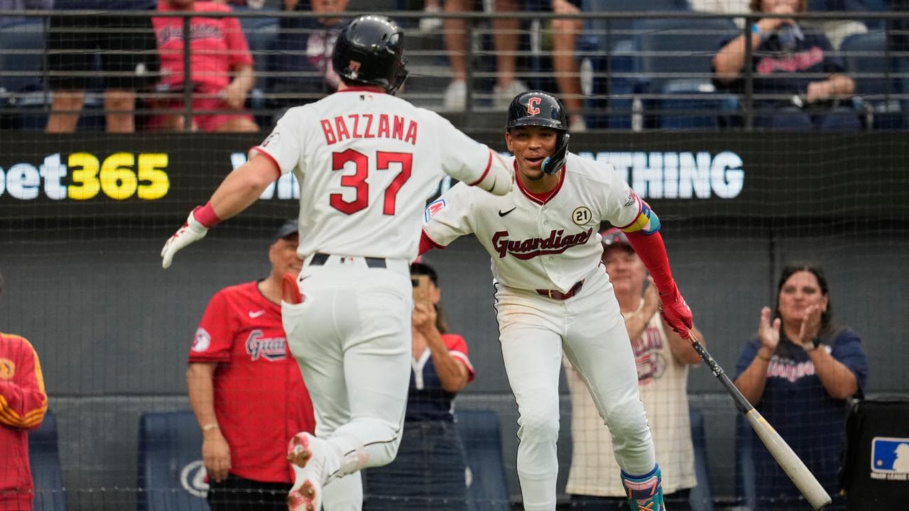Cleveland's Travis Bazzana is congratulated by teammate Angel Genao