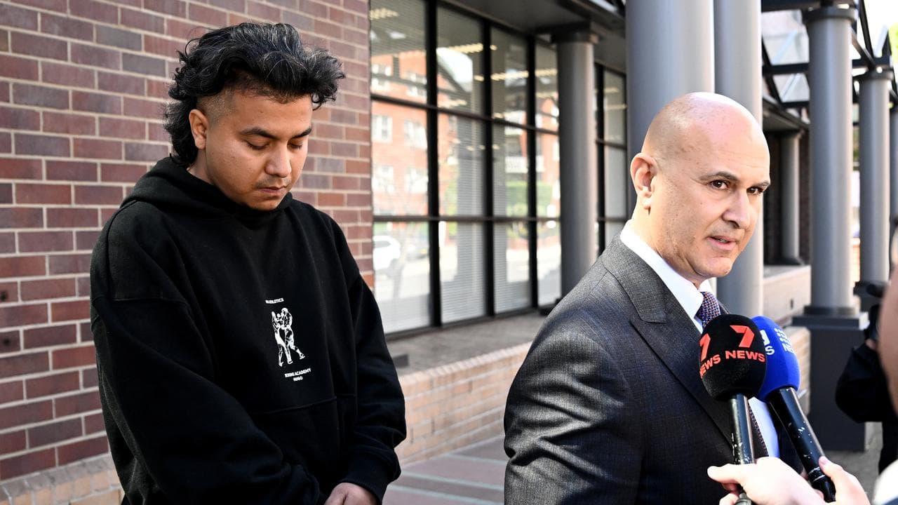 Sandip Adhikari looks on as lawyer Danny Eid speaks