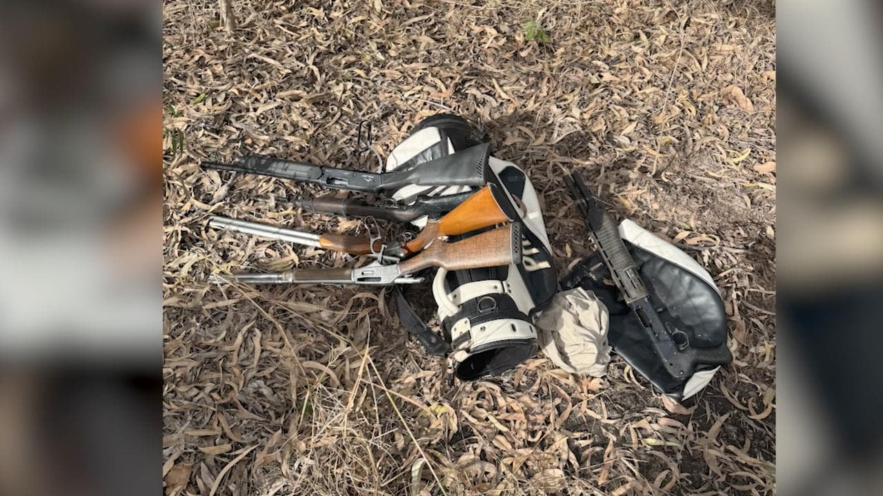 Rifles and a golf bag