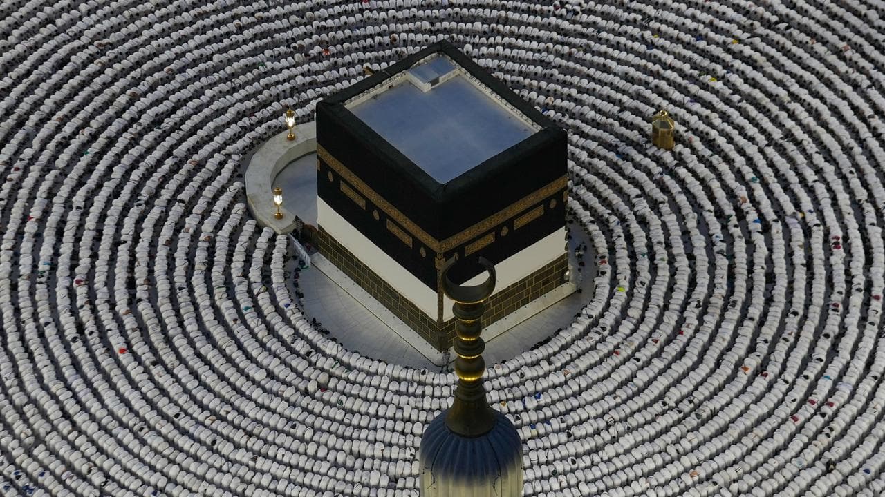 Muslim pilgrims offer evening prayers around the Kaaba in Mecca