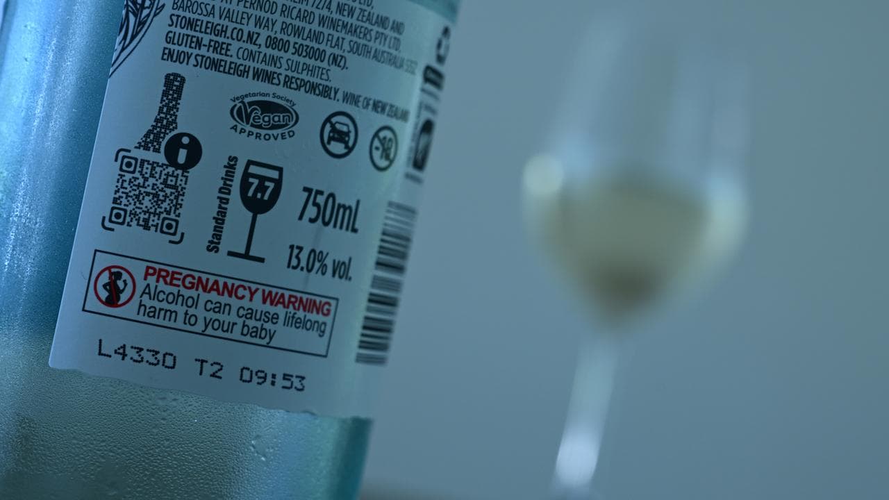 A bottle of white and a glass of wine