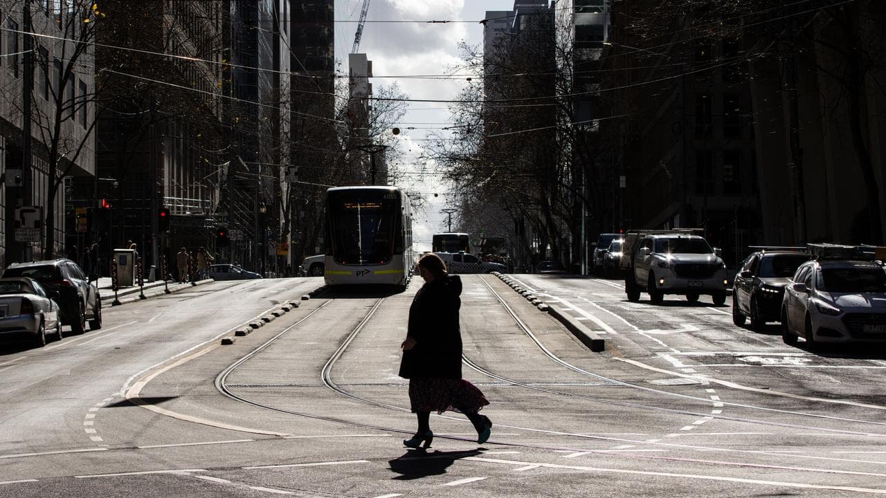 A person is seen walking in Melbourne,
