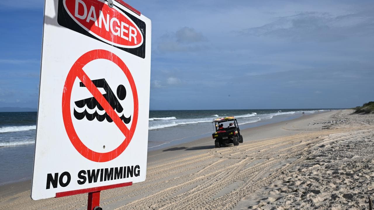 No swimming sign on beach