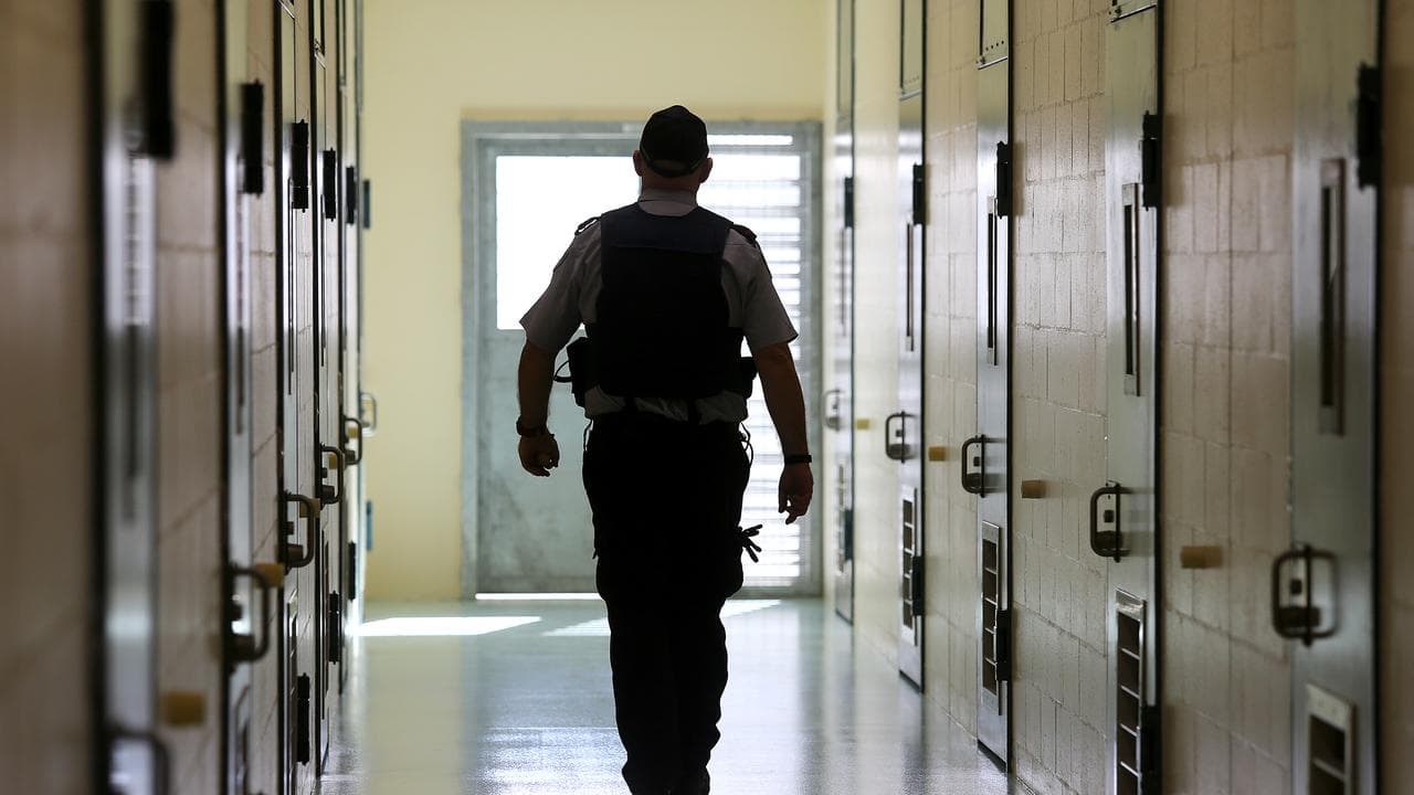 An officer walks down a cell corridor at Borallon, in Brisbane,
