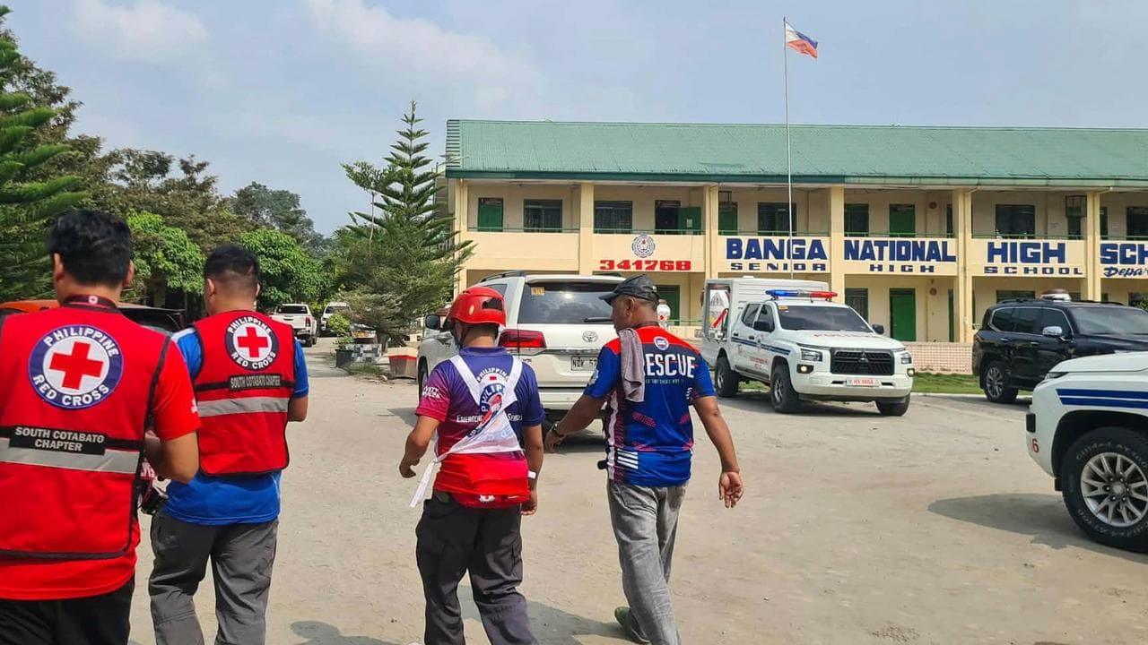 Red Cross members arrive at Banga National High School