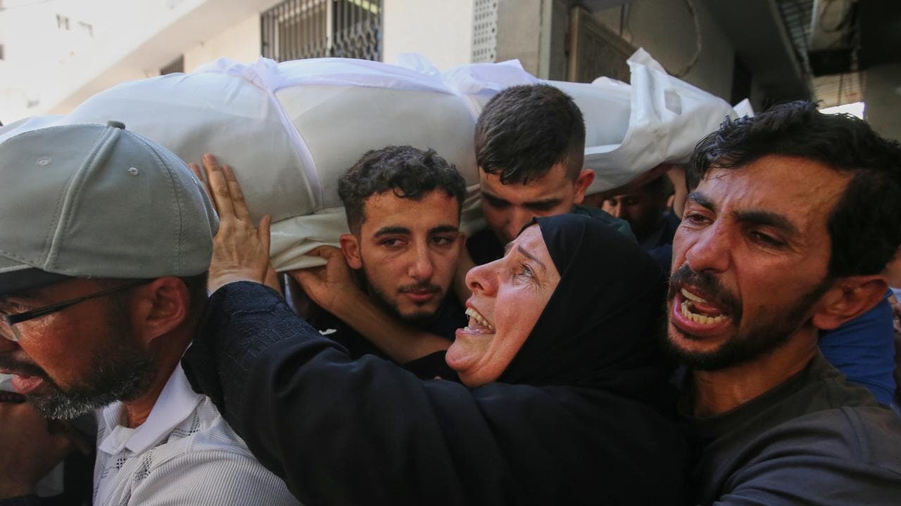 Mourners carry the body of Palestinian Bassir al Barsh