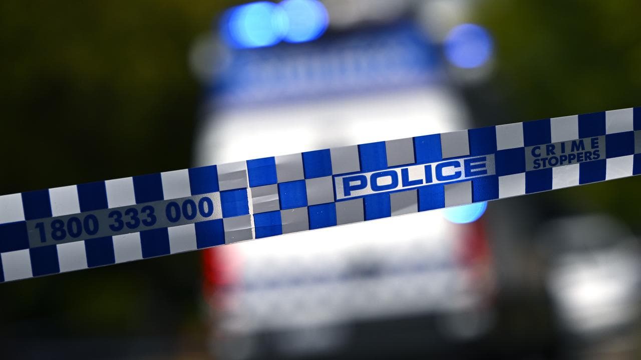 Police tape and vehicle