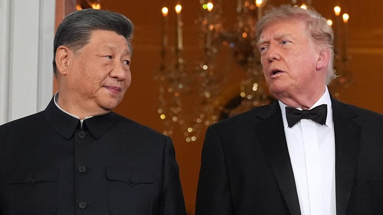 US President Donald Trump talks with China's President Xi Jinping