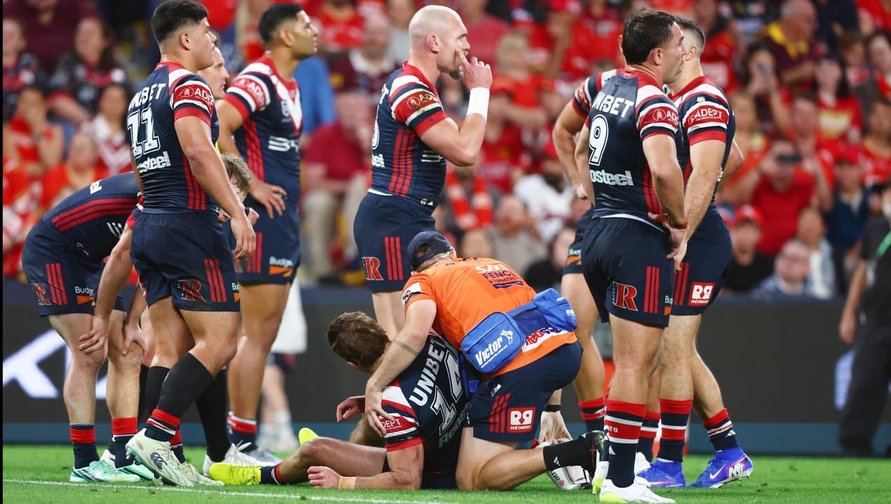Connor Watson of the Roosters receives treatment