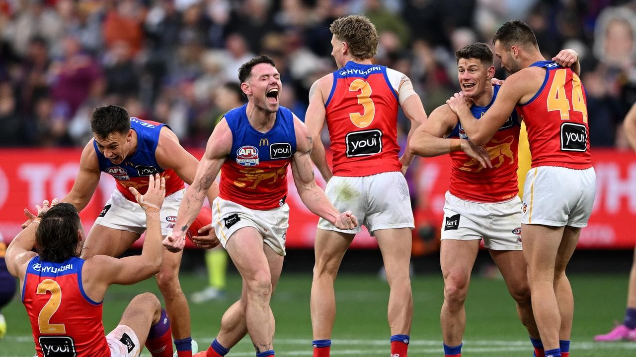 Lachie Neale of the Lions (centre)
