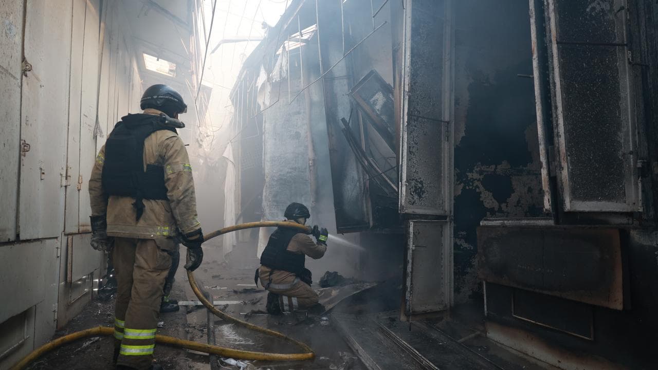Rescue workers after a Russian strike on Zaporizhzhia, Ukraine