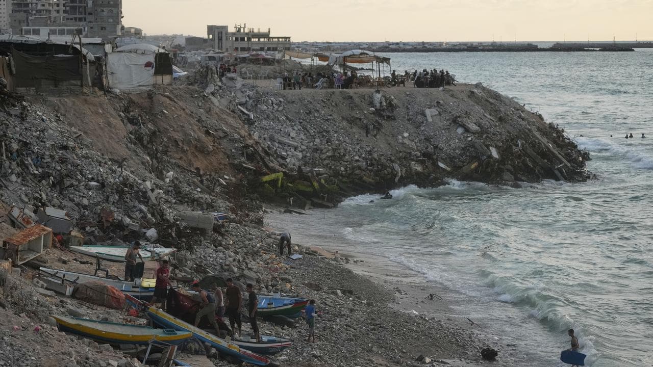 Palestinian fishermen dock their boats