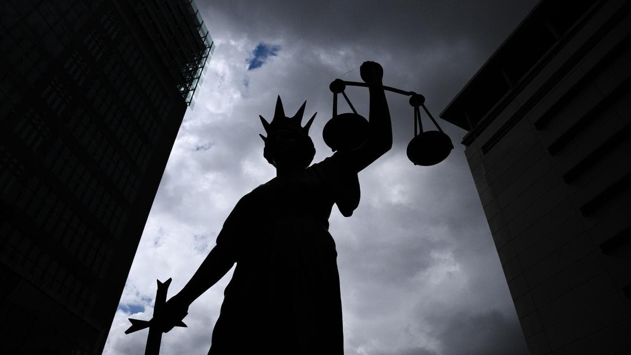 Silhouette of Lady Justice statue 