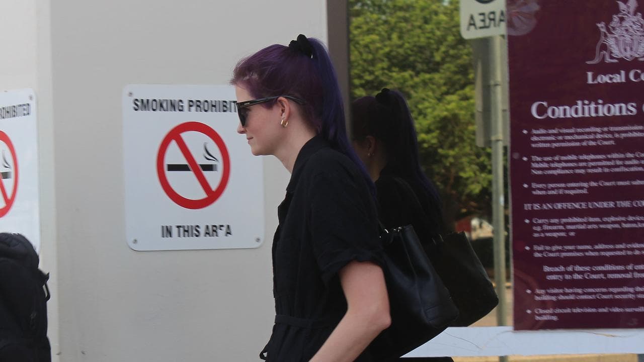 woman leaves court