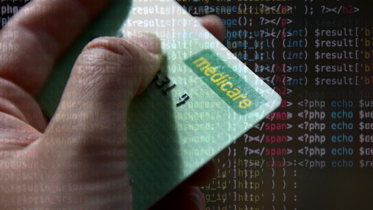 A Medicare card and lines of code