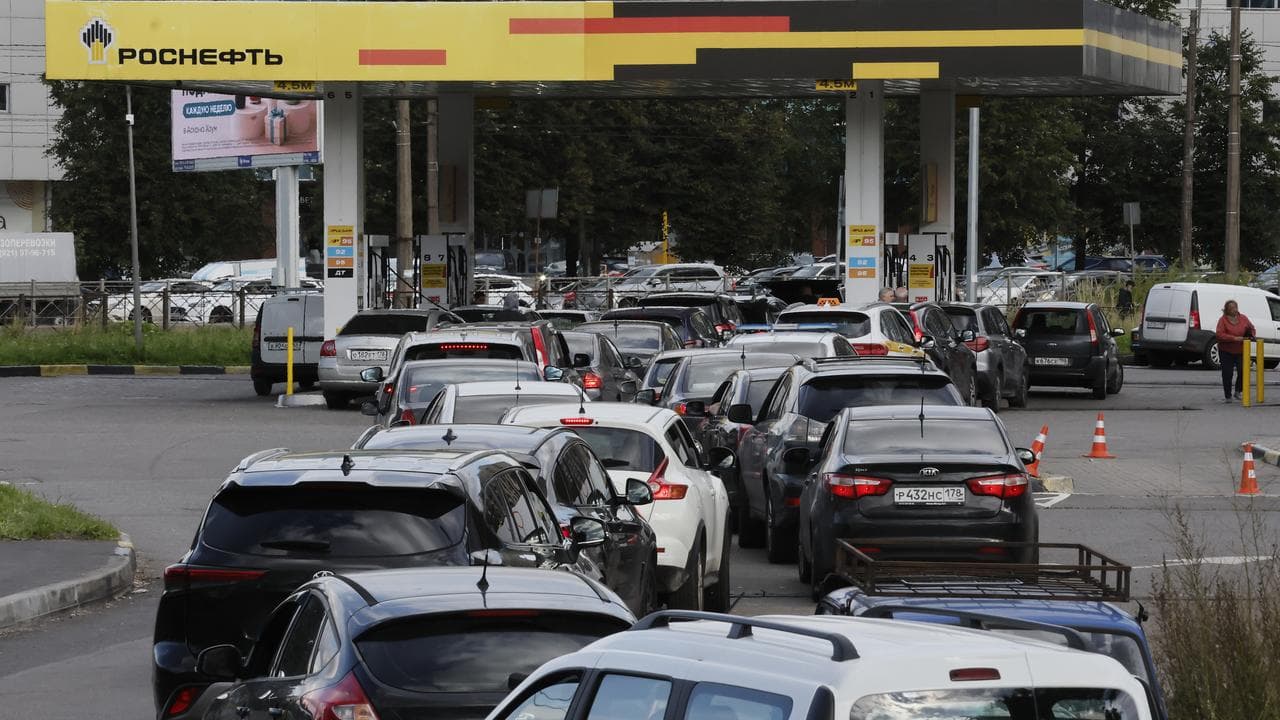 Vehicles line up at a Rosneft gas station in St Petersburg, Russia