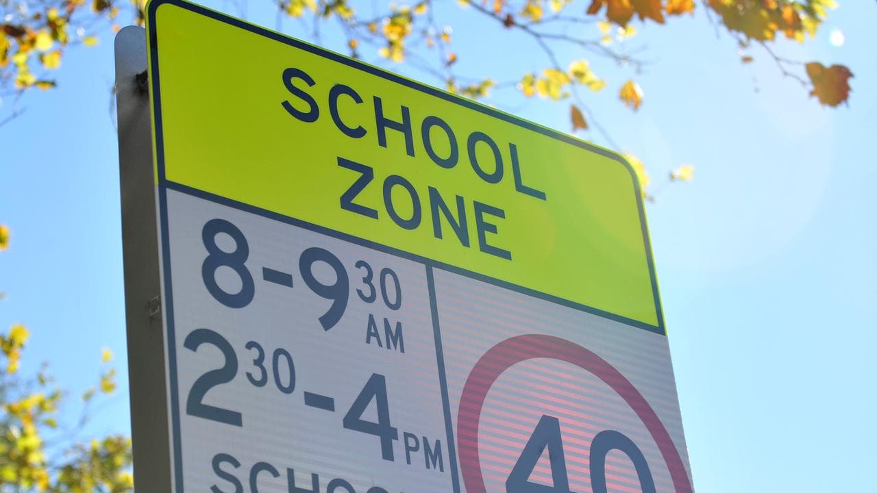 A sign warning of a school zone 