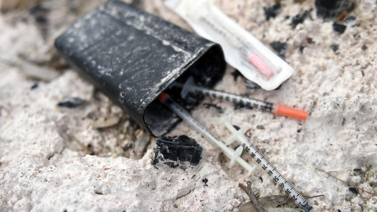 A box containing used needles.