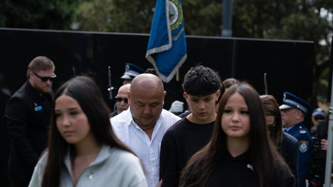 Constable Mia Lay's family lay a wreath during Police Remembrance Day