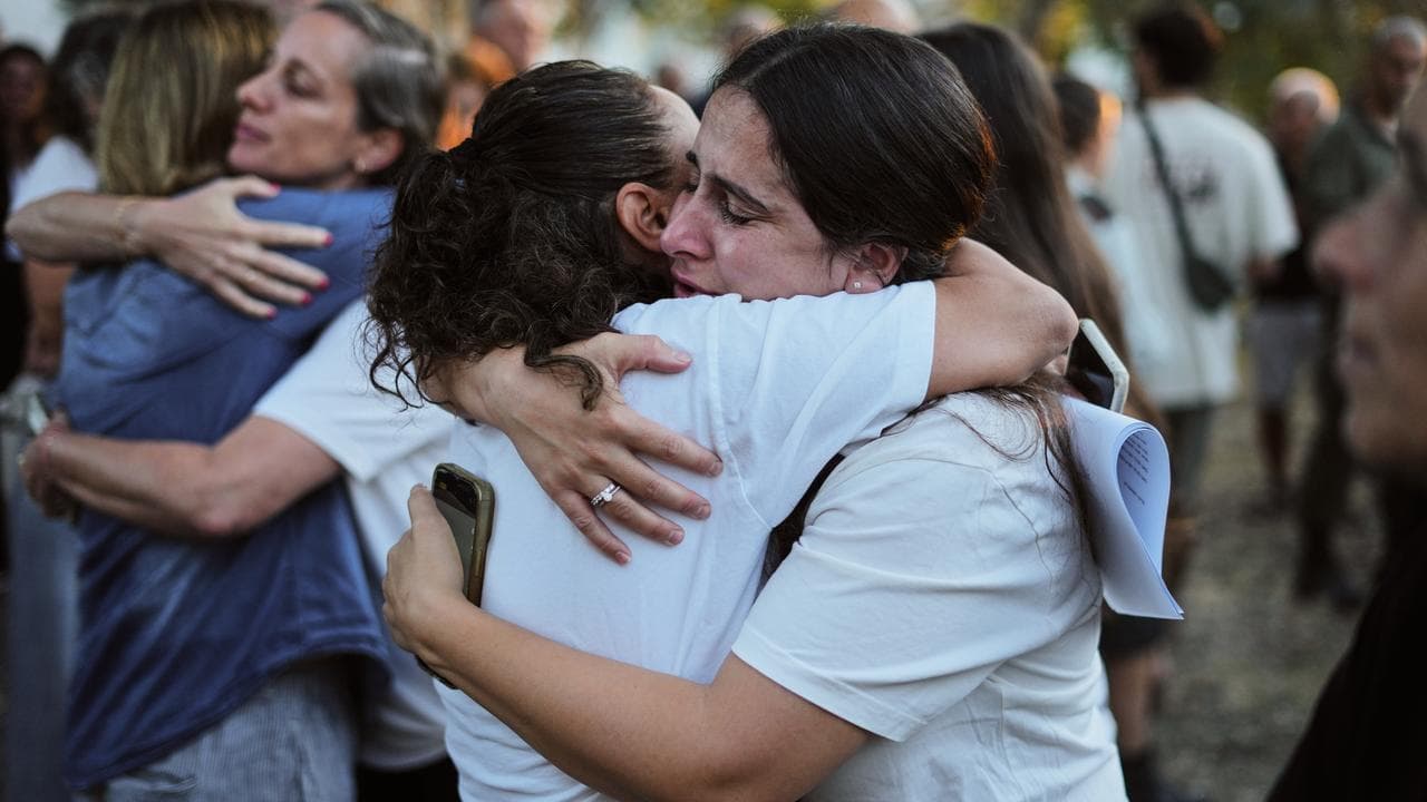People attend a memorial service in Israel for the October 7 attack