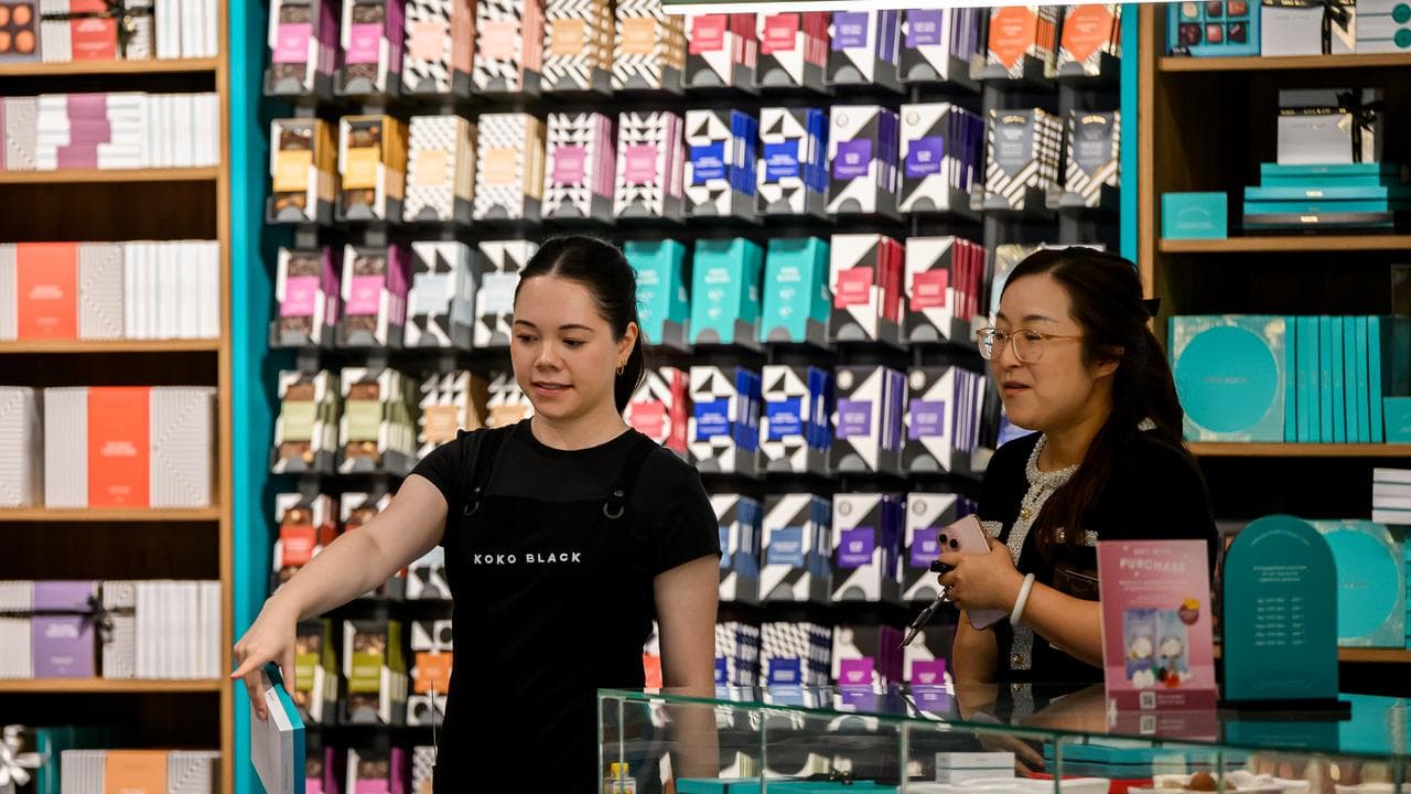 A female retail worker is seen at work