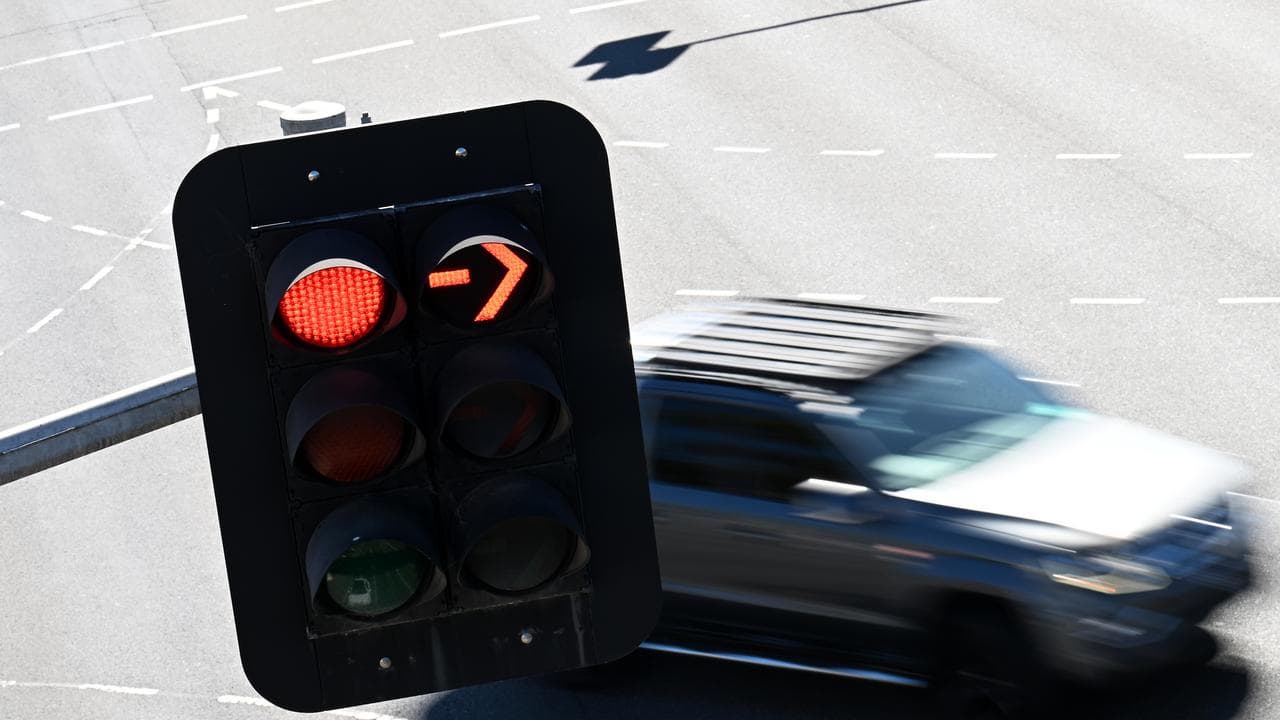 A car passing a traffic light