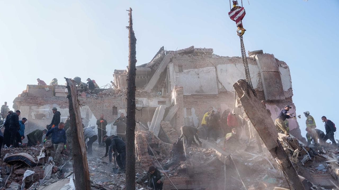Authorities and locals searching through the rubble.