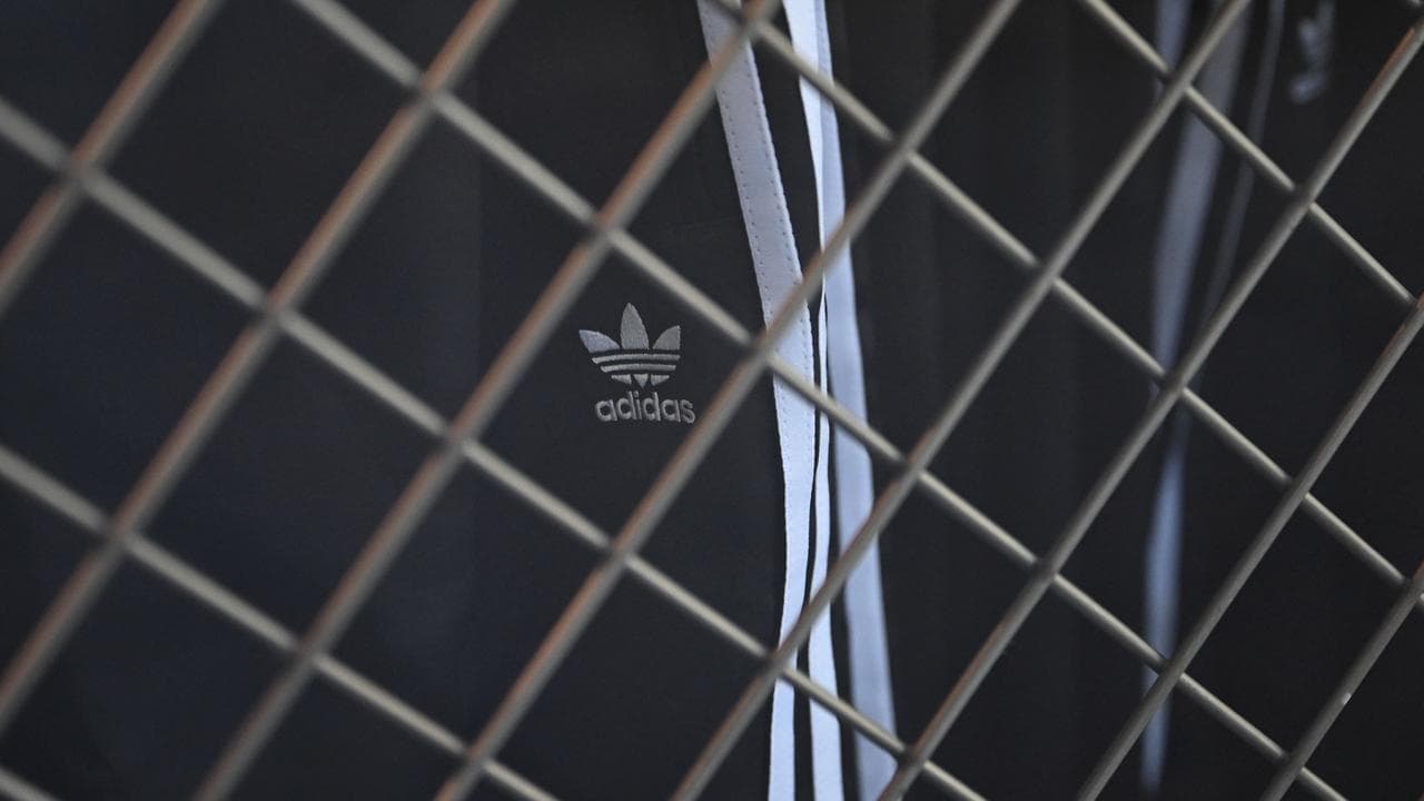 The Adidas logo is seen on a pair of pants at a store
