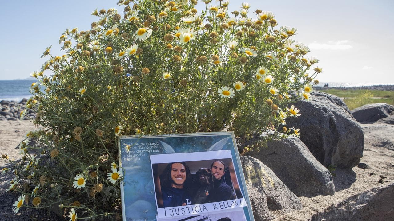 Photos of the victims placed on a beach in Mexico.