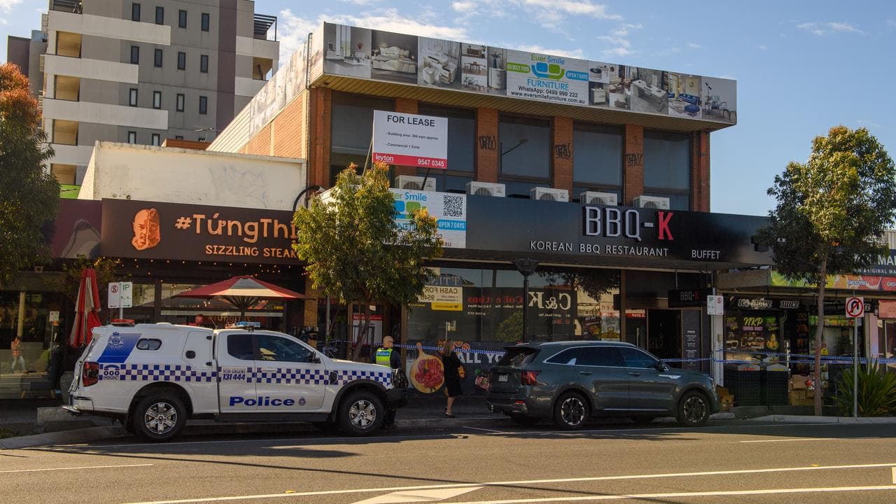 A police vehicle outside a restaurant after a break-in and fire