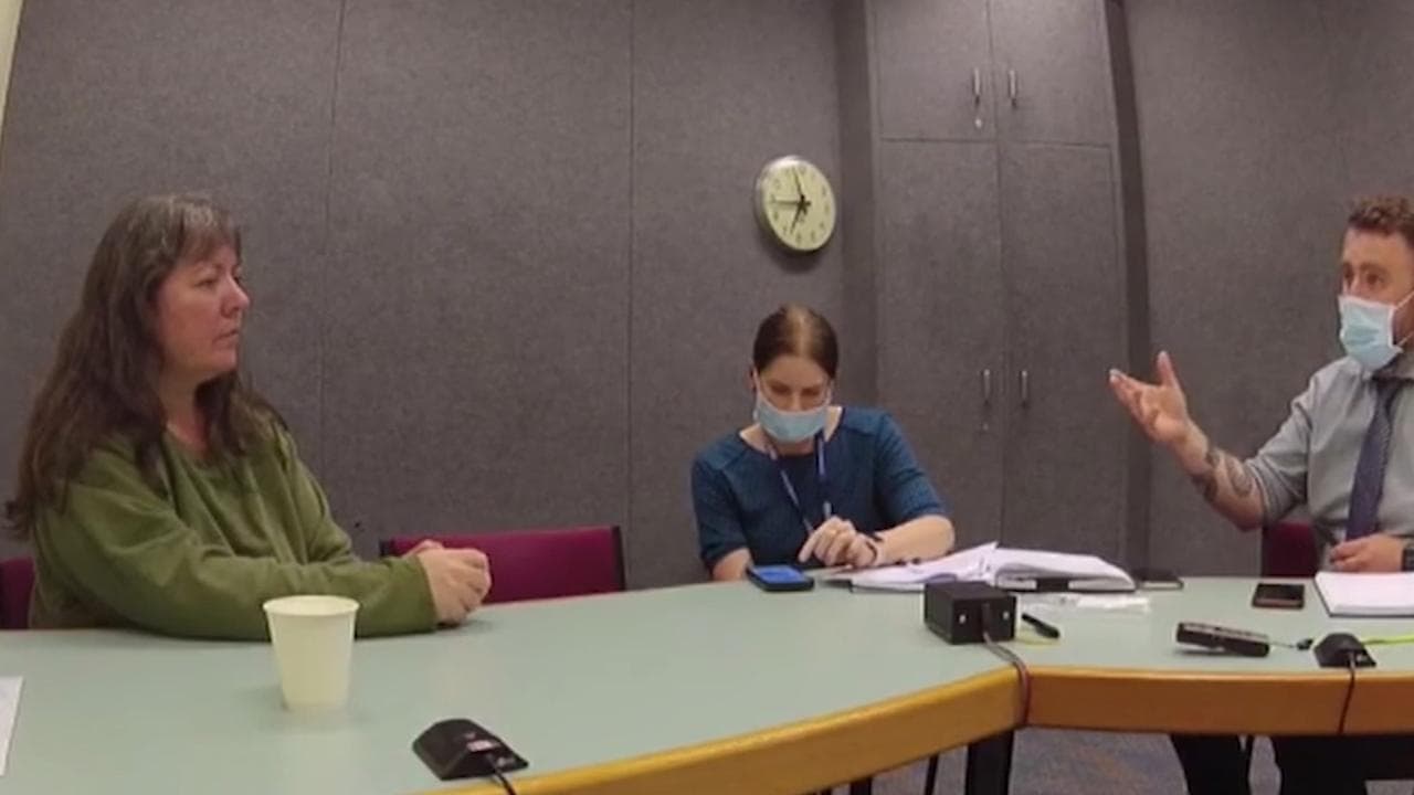 middle-aged woman in police interview