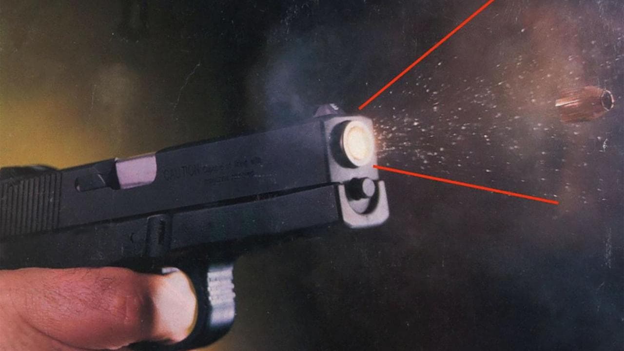 particles and bullet being fired from a gun