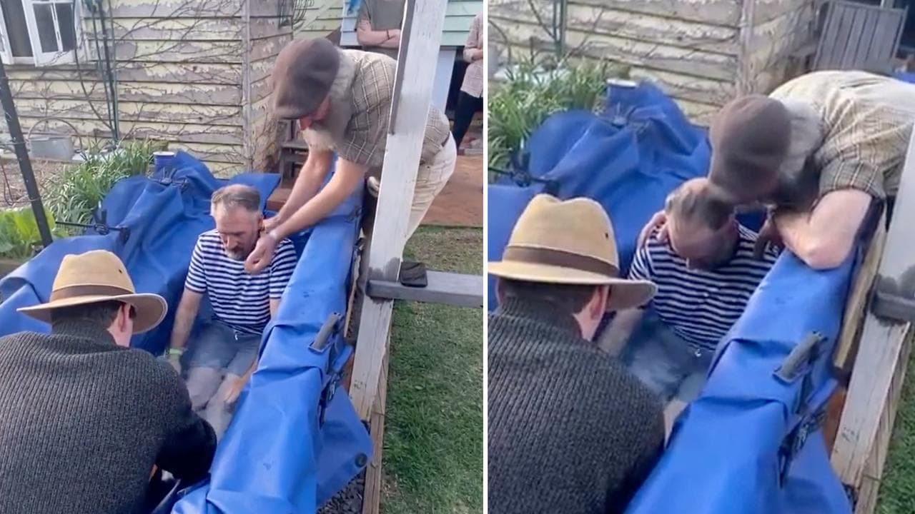 man in backyard baptism