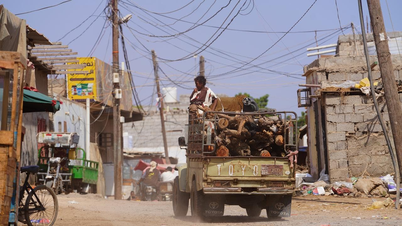 A truck drives through the Al-Basateen neighborhood in Aden, Yemen