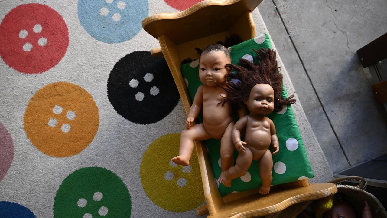 dolls on a mat