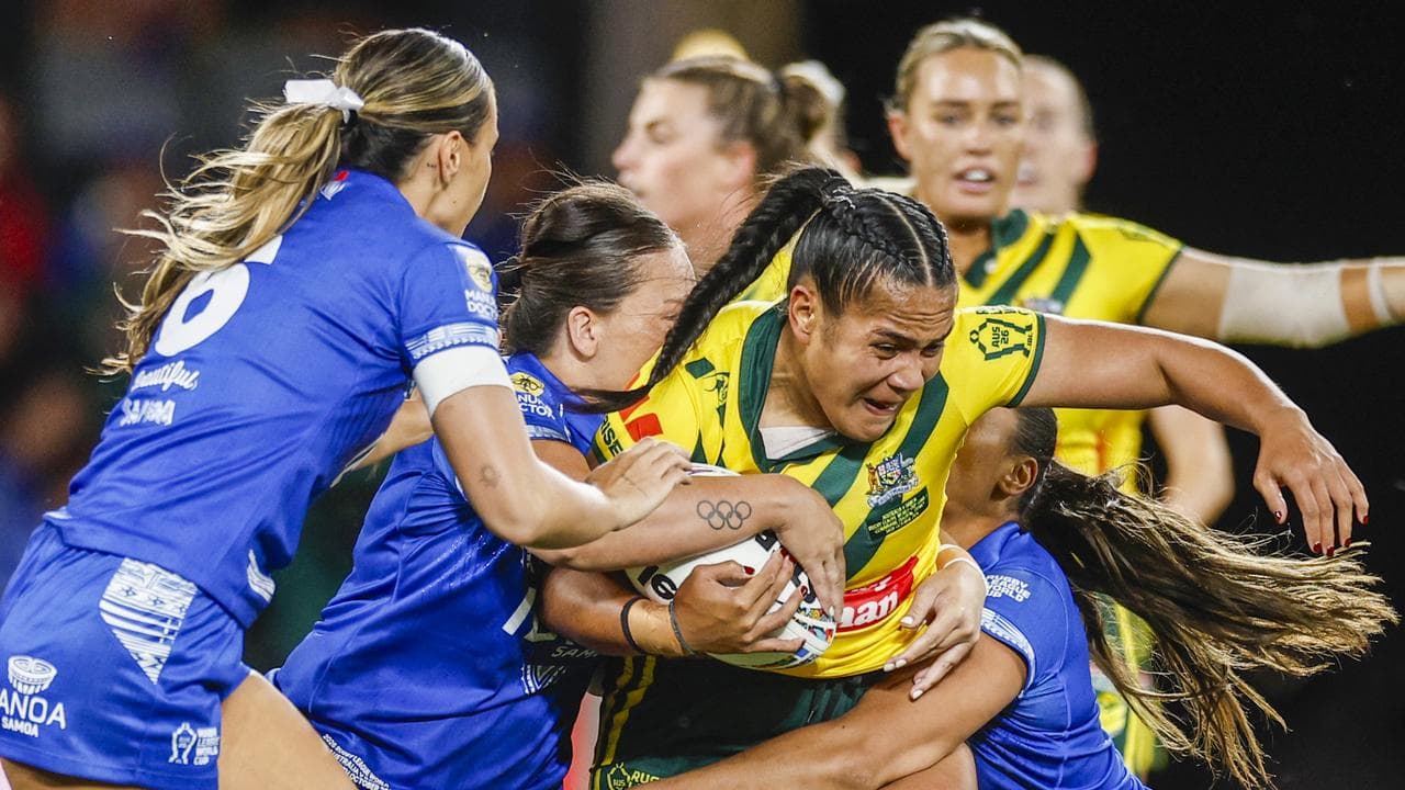 Simaima Taufa of Australia is tackled